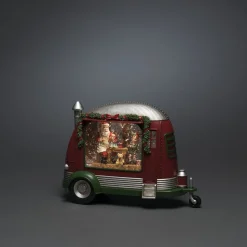 Caravan met kerstman die speelgoed repareert